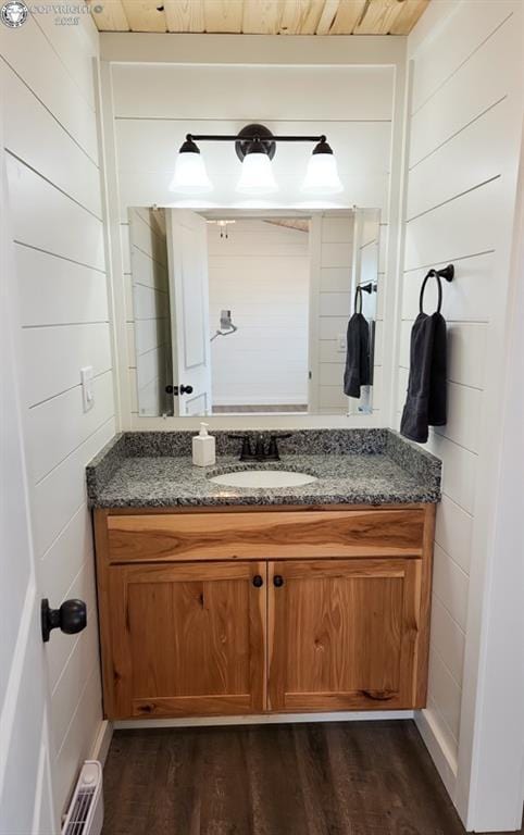 bathroom with vanity and wood finished floors