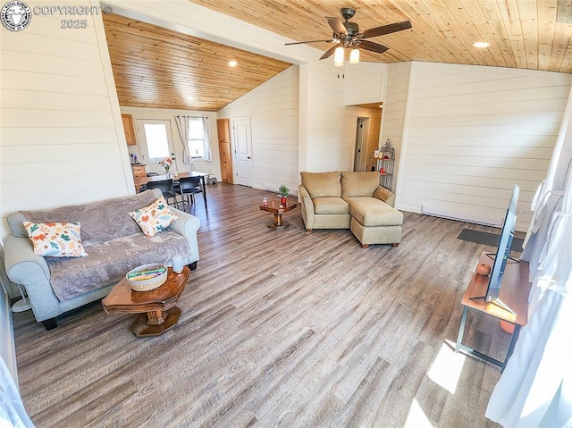 living room featuring wood walls, a ceiling fan, wood finished floors, vaulted ceiling, and wood ceiling