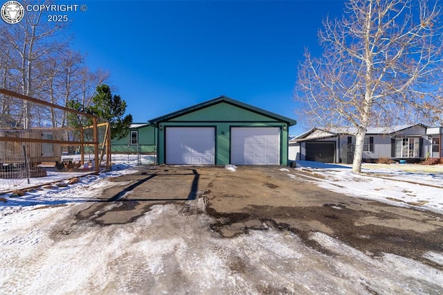 view of snow covered garage