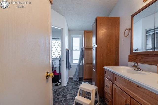 bathroom featuring vanity and a textured ceiling