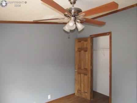 unfurnished bedroom with a closet and wood finished floors
