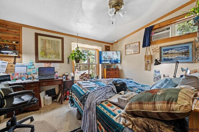 bedroom featuring lofted ceiling, ornamental molding, carpet, ceiling fan, and a textured ceiling