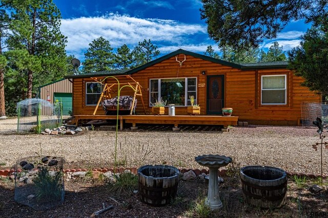 back of house featuring a garage