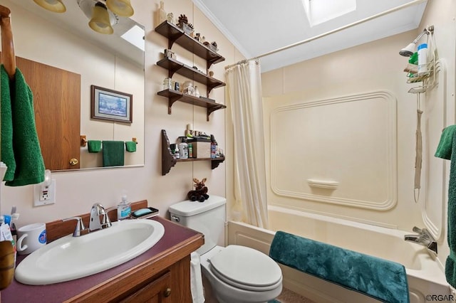 full bathroom with toilet, a skylight, shower / tub combo, ornamental molding, and vanity