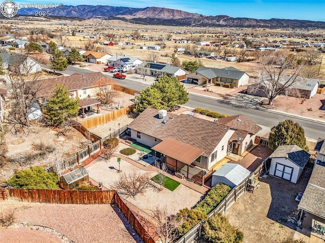 birds eye view of property featuring a mountain view and a residential view