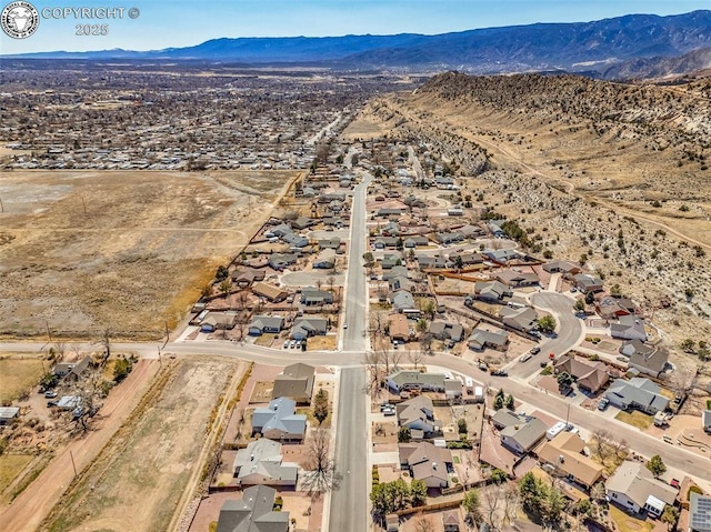 bird's eye view with a mountain view, a residential view, and a desert view