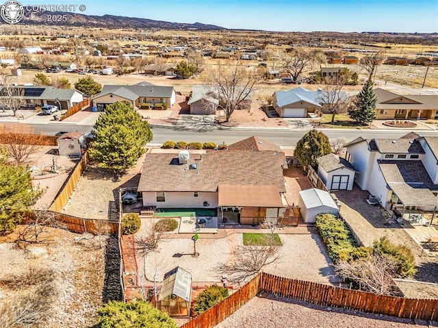 birds eye view of property featuring a mountain view and a residential view