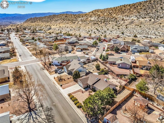 birds eye view of property featuring a mountain view and a residential view