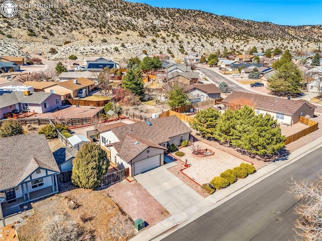 drone / aerial view with a mountain view and a residential view