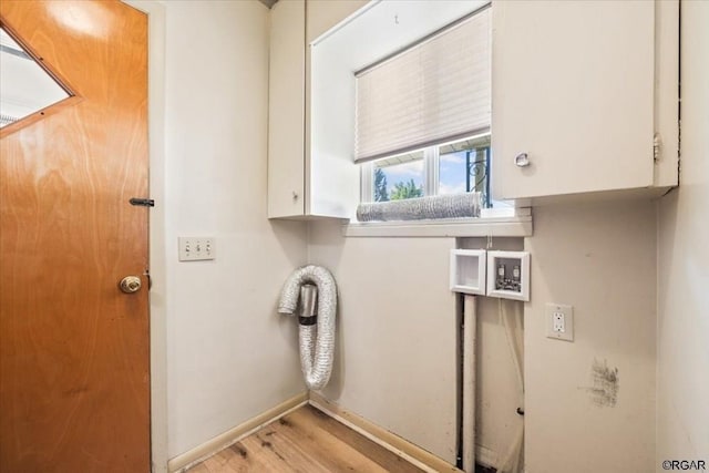 washroom with cabinets and light wood-type flooring