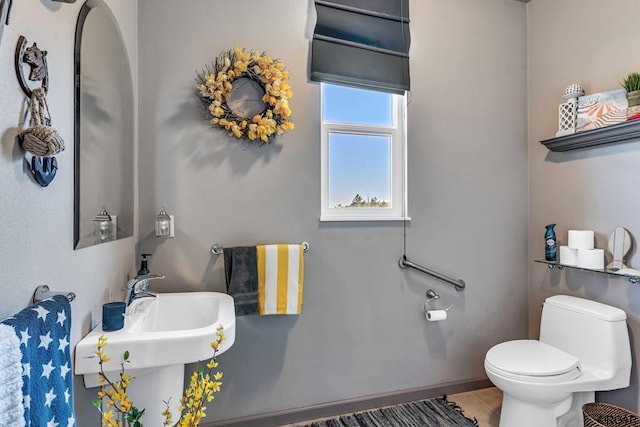 bathroom with tile patterned floors and toilet