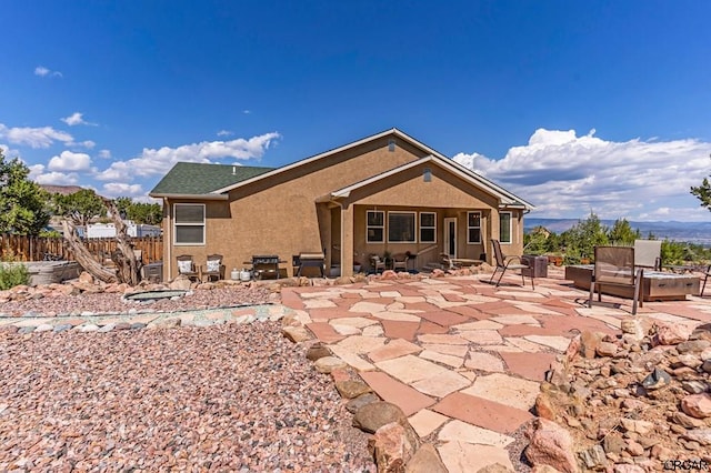 back of property featuring a patio