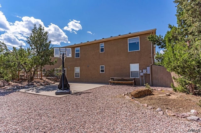 back of property featuring a patio area