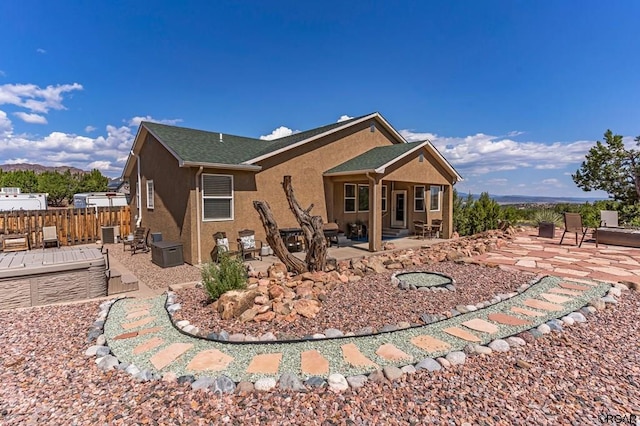 back of property featuring a patio area