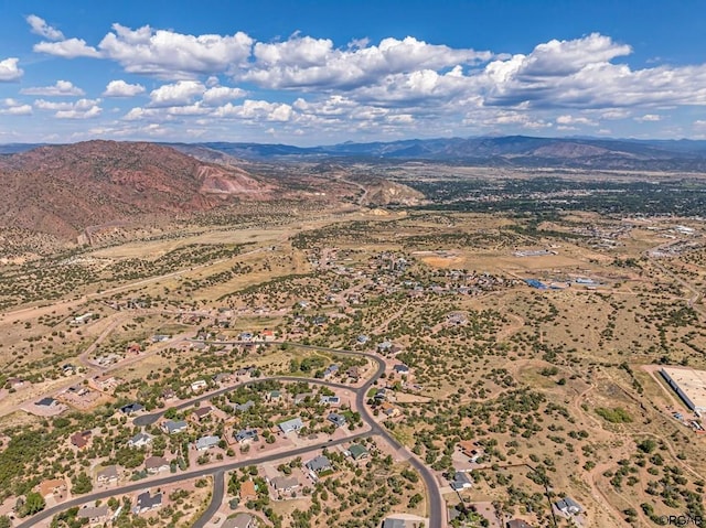 birds eye view of property featuring a mountain view