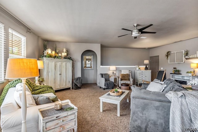 living room with ceiling fan and light colored carpet