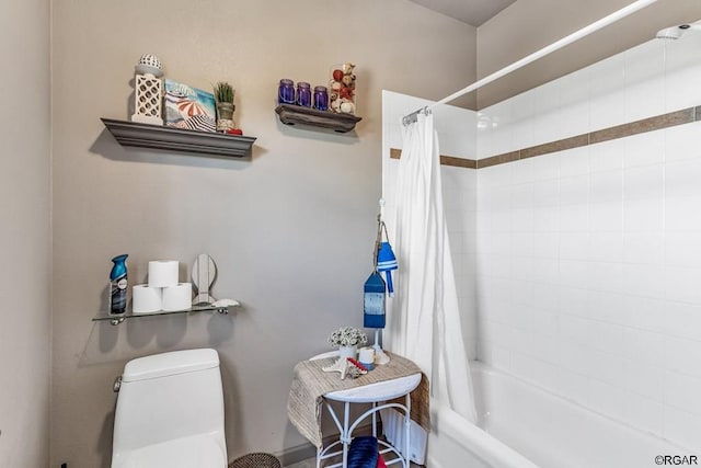 bathroom with shower / bathtub combination with curtain and toilet