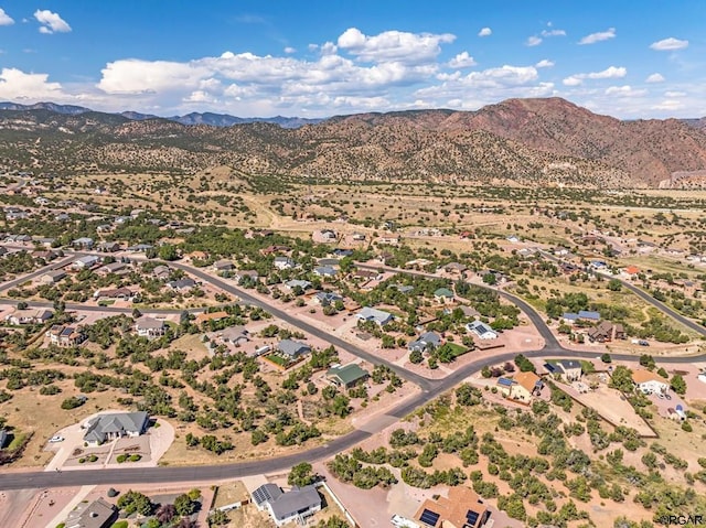 birds eye view of property featuring a mountain view