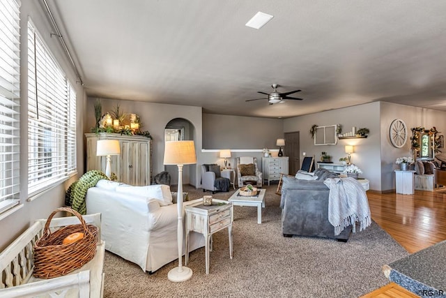 living room with hardwood / wood-style flooring and ceiling fan