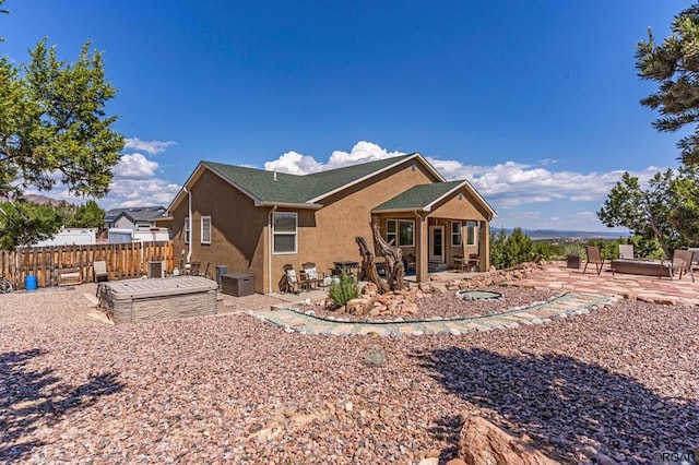 rear view of property with a patio area