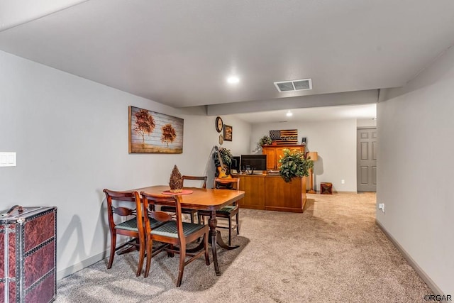 dining area with light carpet