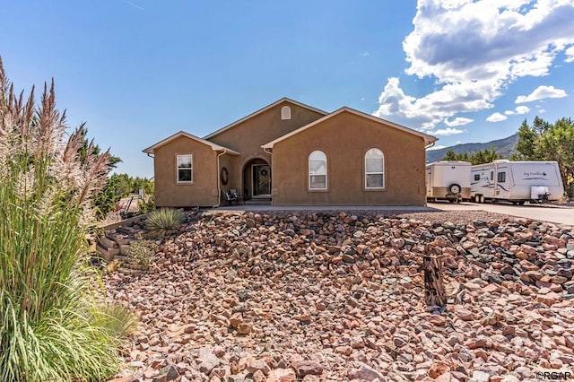 view of front facade featuring a mountain view