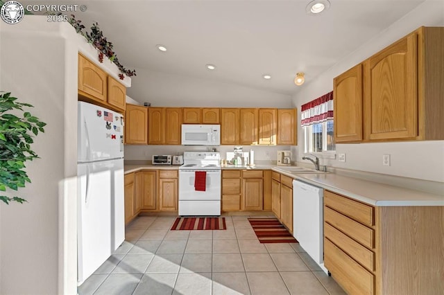 kitchen featuring lofted ceiling, light tile patterned floors, white appliances, sink, and light brown cabinets