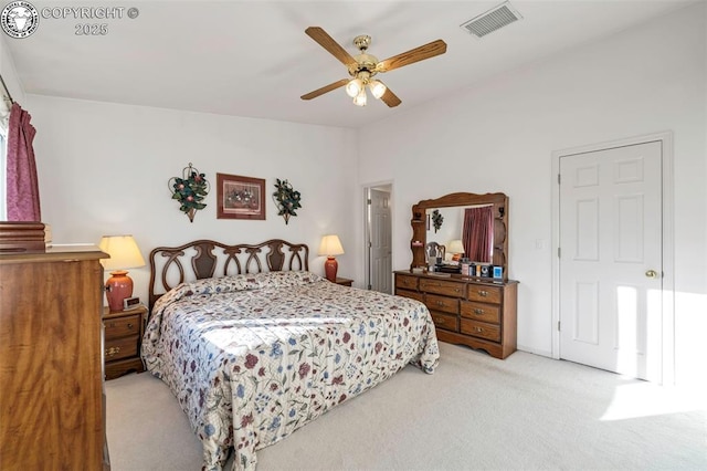 bedroom with light carpet and ceiling fan