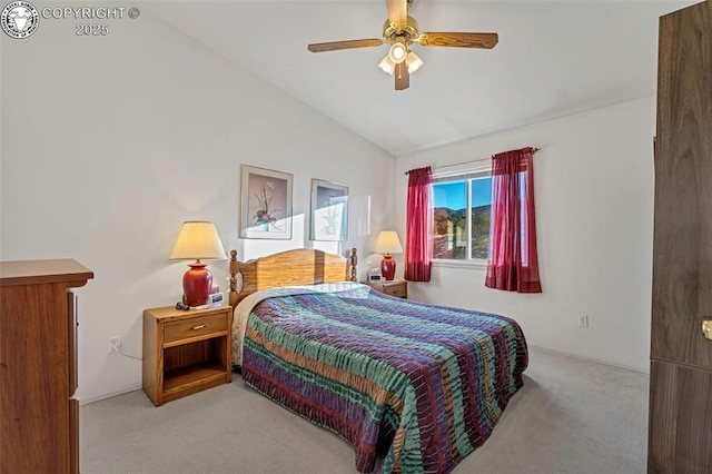 bedroom featuring ceiling fan, light colored carpet, and lofted ceiling