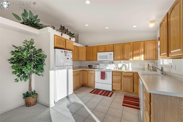 kitchen with light tile patterned flooring, light brown cabinetry, sink, vaulted ceiling, and white appliances