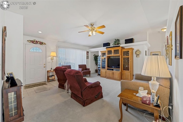 carpeted living room featuring ceiling fan