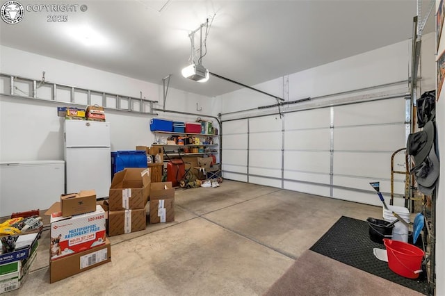 garage with white refrigerator, a garage door opener, and refrigerator