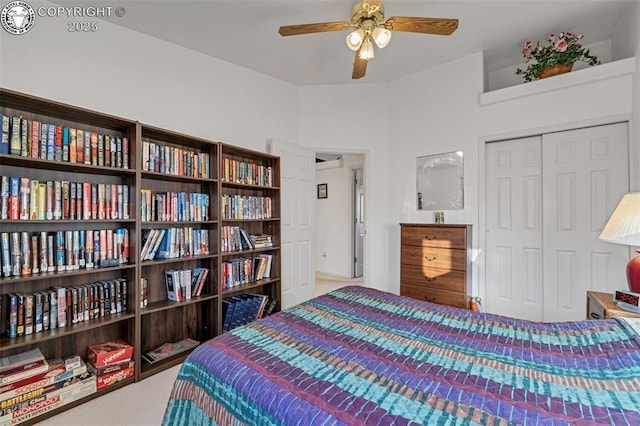 bedroom featuring ceiling fan and a closet