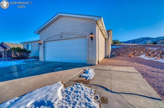 exterior space featuring a mountain view and a garage