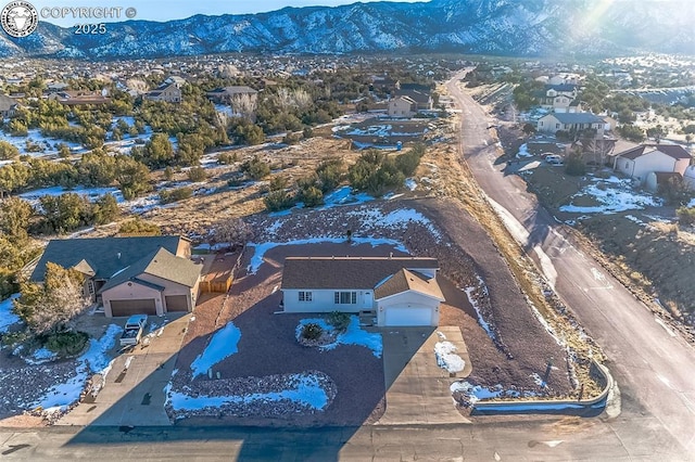 birds eye view of property featuring a mountain view