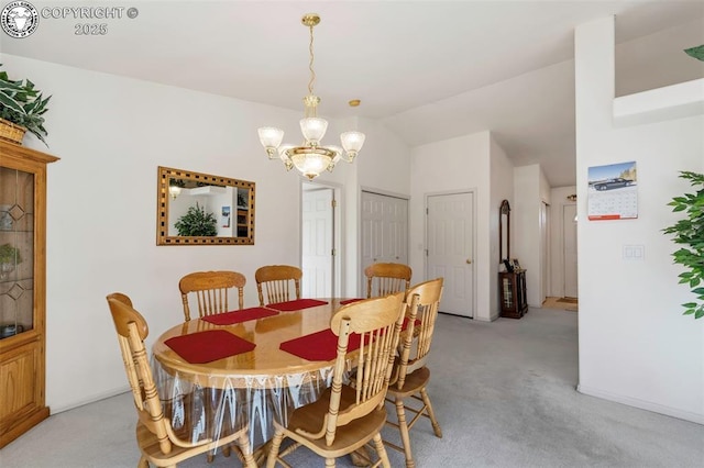 dining area featuring light colored carpet, lofted ceiling, and a notable chandelier