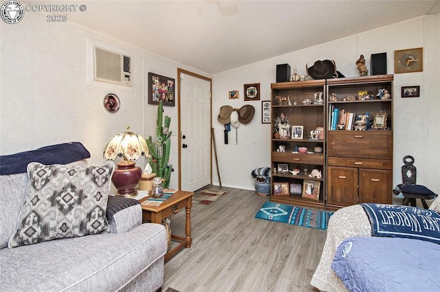 510 N 19th St Unit 1, Canon City, CO 81212 - living area featuring light wood-style flooring and an AC wall unit