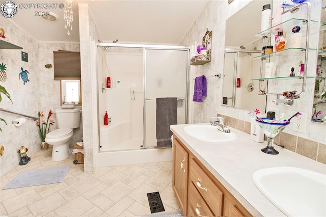 510 N 19th St Unit 1, Canon City, CO 81212 - bathroom featuring a stall shower, double vanity, tile patterned floors, and tile walls