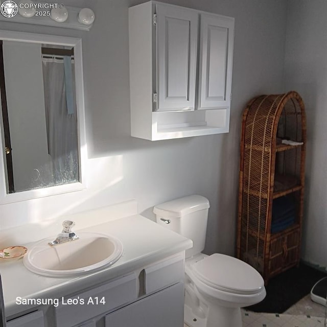 bathroom with vanity and toilet