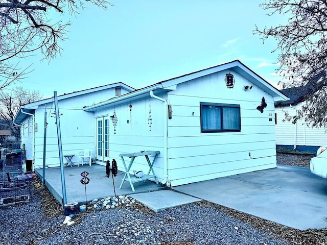 view of side of property featuring a patio area