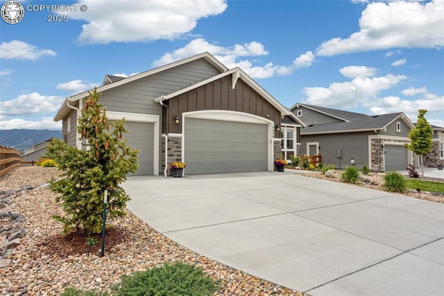 16840 New Autumn Dr, Monument, CO 80132 - view of front of house with a garage, board and batten siding, concrete driveway, and stone siding