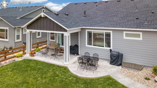 16840 New Autumn Dr, Monument, CO 80132 - back of house featuring roof with shingles, board and batten siding, and a patio