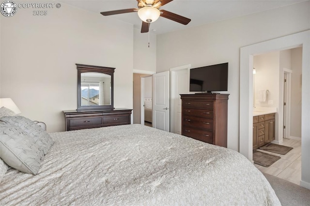 16840 New Autumn Dr, Monument, CO 80132 - bedroom featuring lofted ceiling, ensuite bath, and ceiling fan