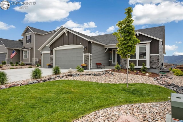 16840 New Autumn Dr, Monument, CO 80132 - craftsman inspired home with board and batten siding, a garage, a front lawn, stone siding, and concrete driveway
