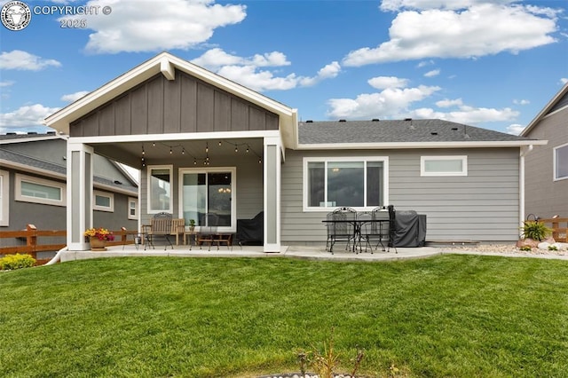 16840 New Autumn Dr, Monument, CO 80132 - rear view of property featuring a patio, a lawn, board and batten siding, and a shingled roof