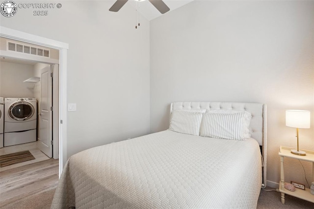16840 New Autumn Dr, Monument, CO 80132 - bedroom with washing machine and clothes dryer, vaulted ceiling, wood finished floors, and ceiling fan