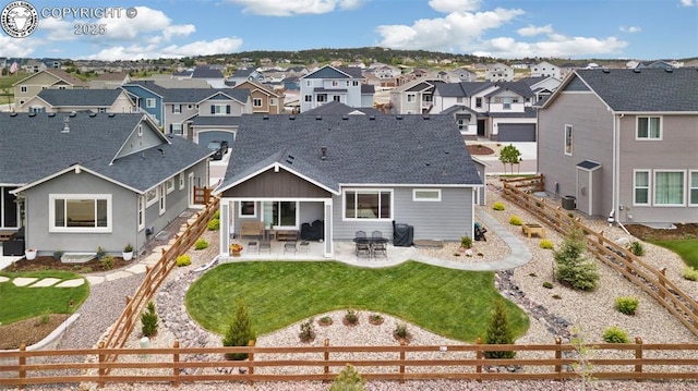 16840 New Autumn Dr, Monument, CO 80132 - back of house with a residential view, a shingled roof, and a patio area