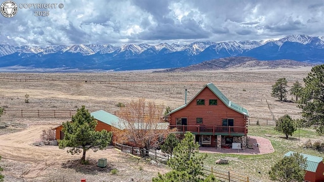 property view of mountains featuring a rural view