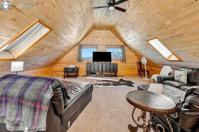 living area with carpet flooring, lofted ceiling with skylight, wood walls, and wooden ceiling
