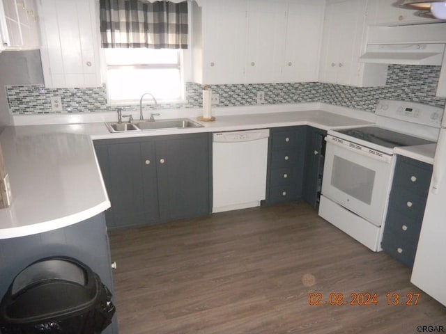 kitchen featuring sink, white appliances, tasteful backsplash, white cabinets, and dark hardwood / wood-style flooring